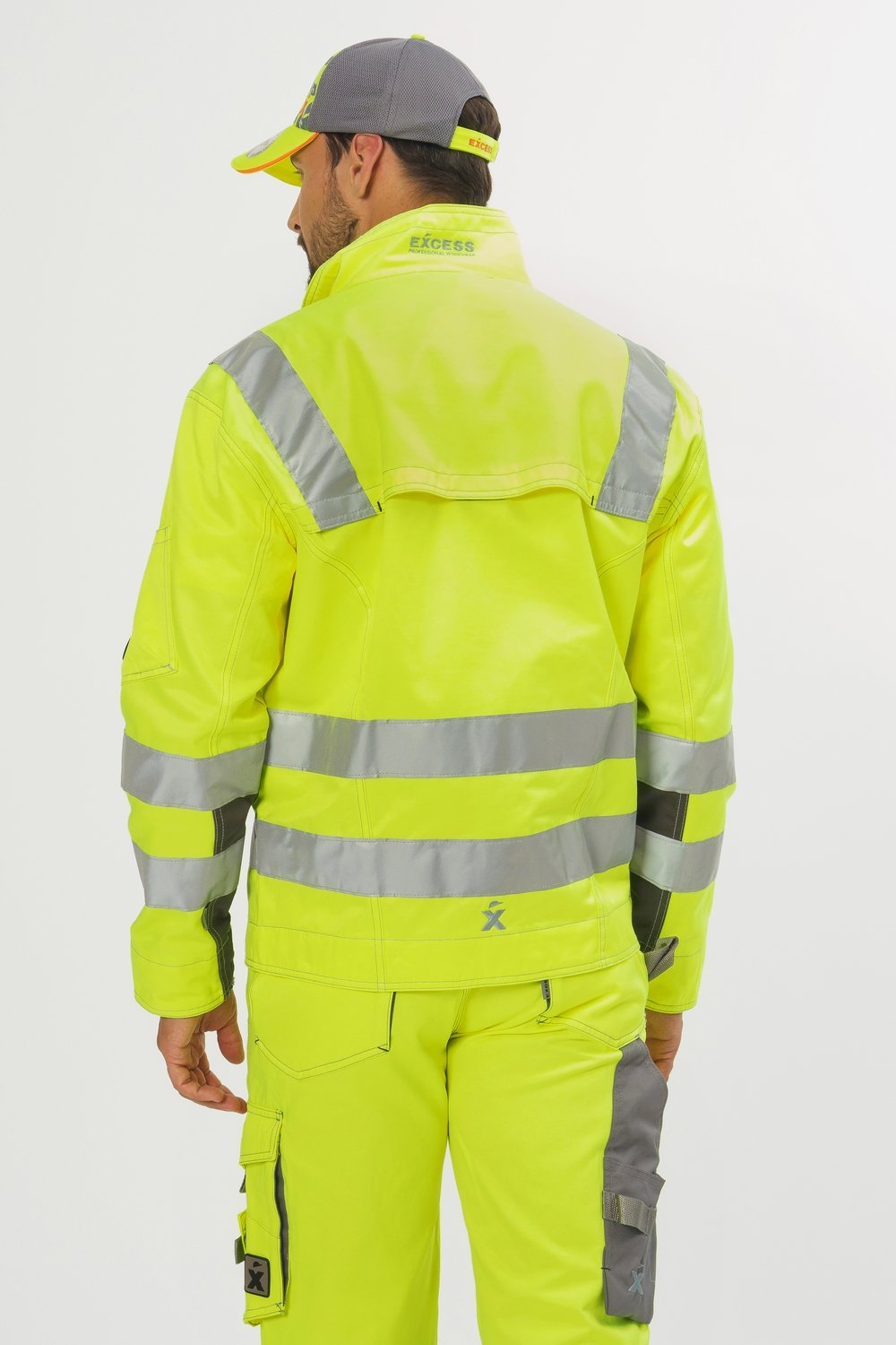 Rückansicht EXCESS Warnschutzjacke gelb mit Reflexstreifen, robuste Arbeitskleidung für Bau und Handwerk.